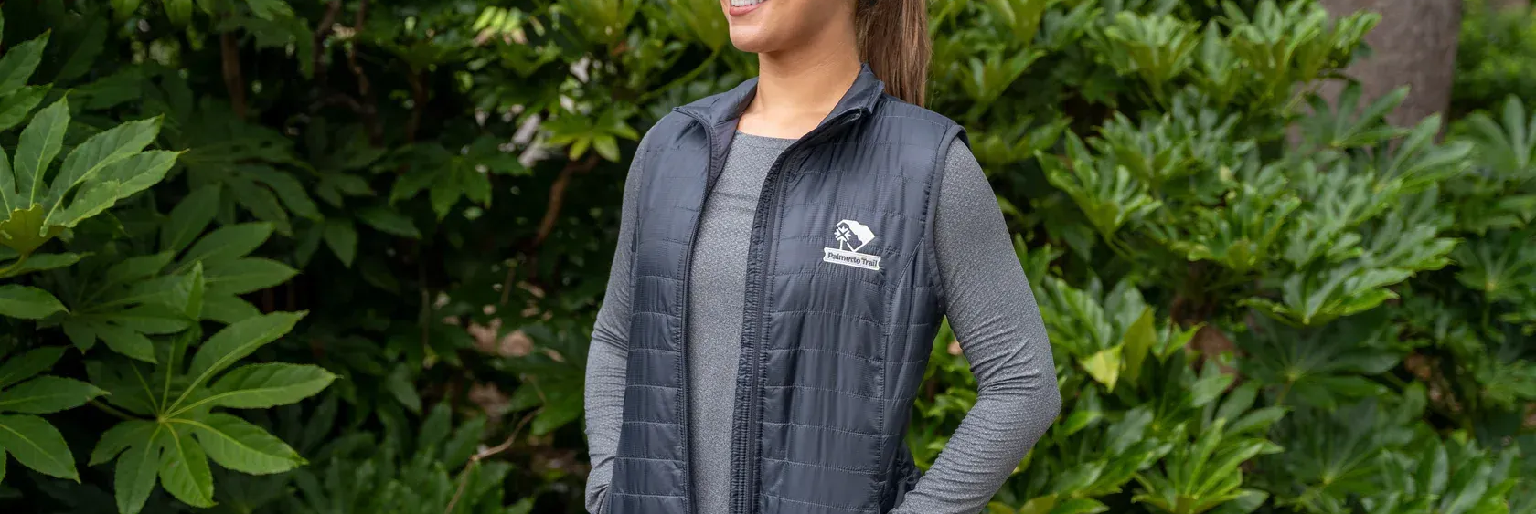 Woman wearing a Palmetto trail vest