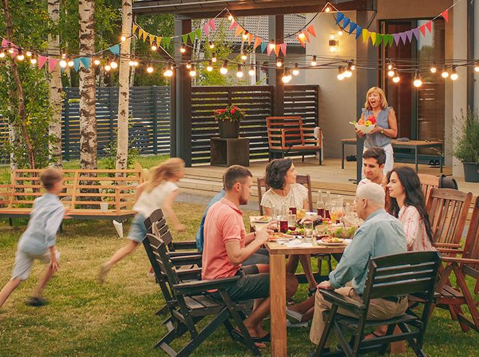 family enjoying their outdoor living space without mosquitoes