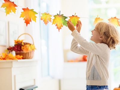 little boy in omaha decorating for fall