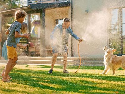 midwest family in their backyard on a hot summer day