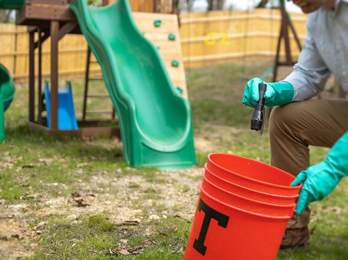 pest pro inspecting property for mosquitoes