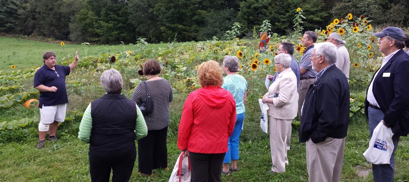 Caravan of Caring participants visit LEAP's Stone Soup Gardens