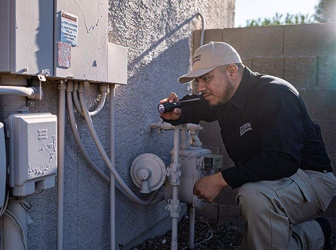 arizona pest tech inspecting a home