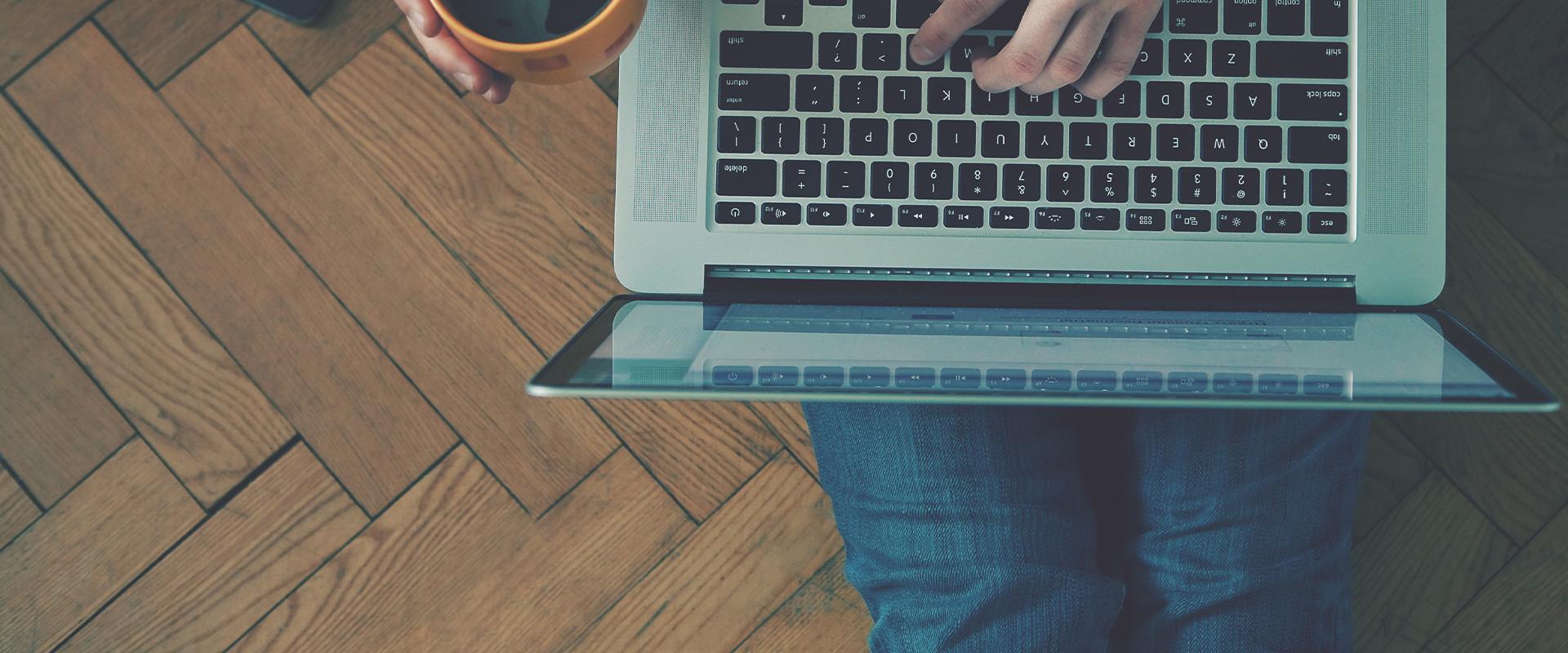 a person typing on a laptop