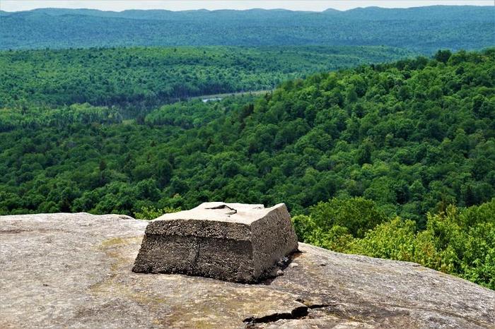 All that is left of the former fire tower are the cement footers (Credit: Wm.Hill/Hiking the trail to Yesterday)
