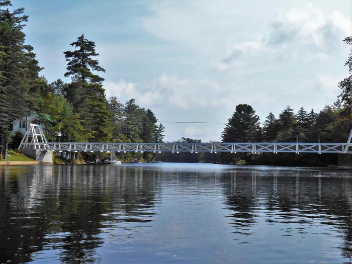 The Wanakena foot bridge over the Cranberry lake inlet, where the Oswegatchie river flows into the lake. (Credit: Wm Hill - Hiking the Trail to Yesterday)