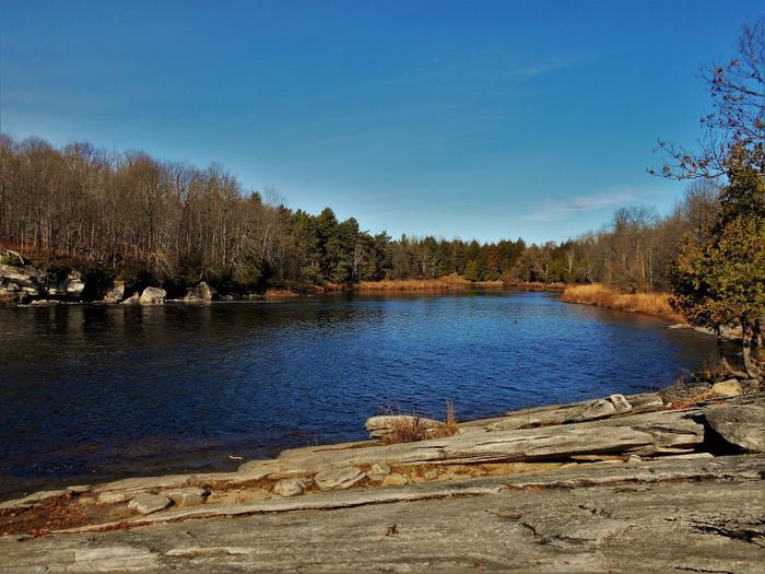 Downstream from the falls (Credit: https://hikingthetrailtoyesterday.wordpress.com/)
