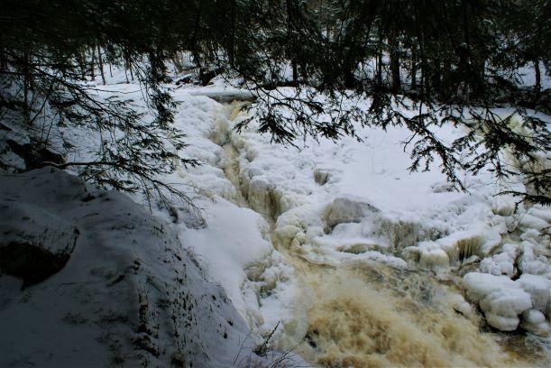 The falls is nearly covered with ice (Credit: Wm Hill/Hiking the trail to yesterday)
