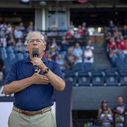 Russ Ives singing the national anthem