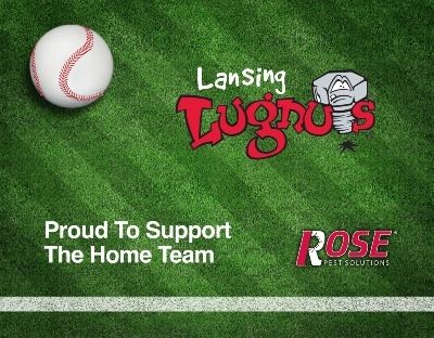 baseball with lansing lugnut logo on turf