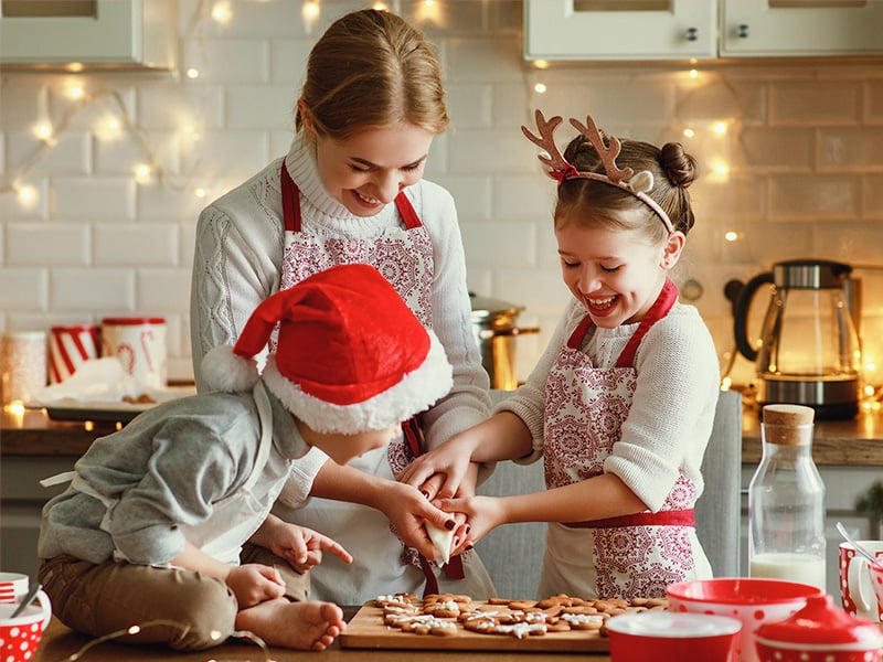 mother and children baking holiday treats