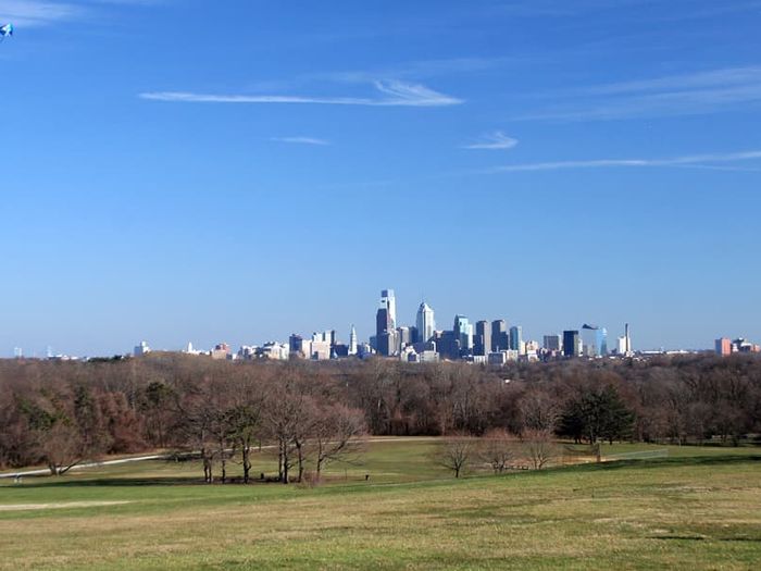 Person Flies Kite Before Philadelphia Skyline (Credit: Bradley Maule via hiddencityphila.org)