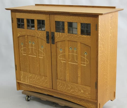 Oak bookcase with doors.