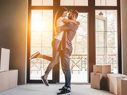 couple hugging in their new denver home