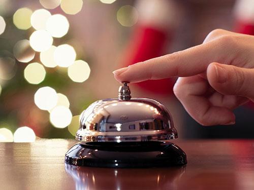 ringing bell at a hotel that has bed bugs inside rooms