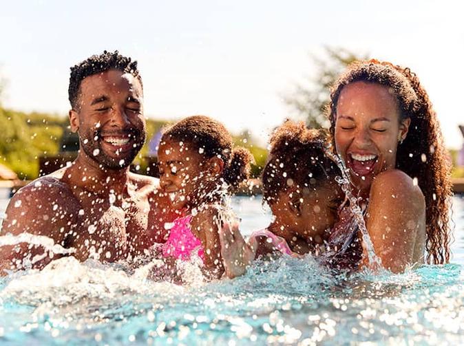 denver family playing in pool