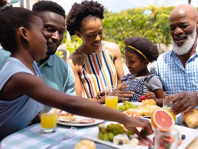 family dining outdoors without wasps