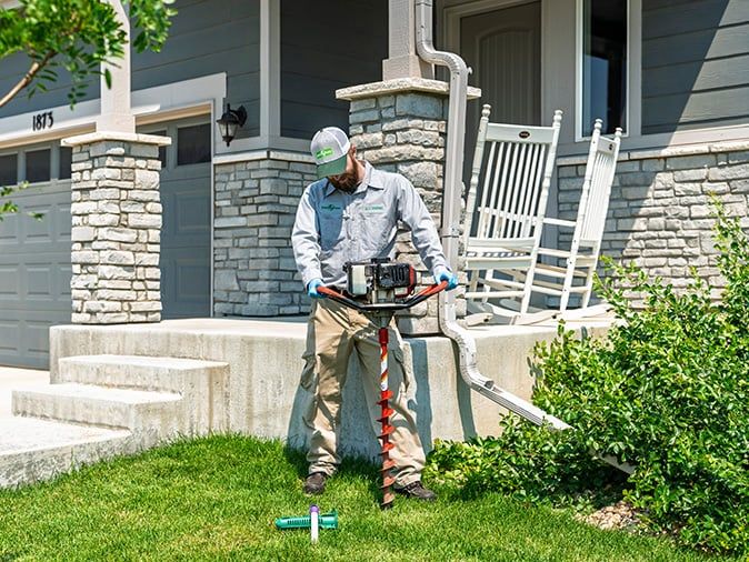 termite control specialist installing sentricon station