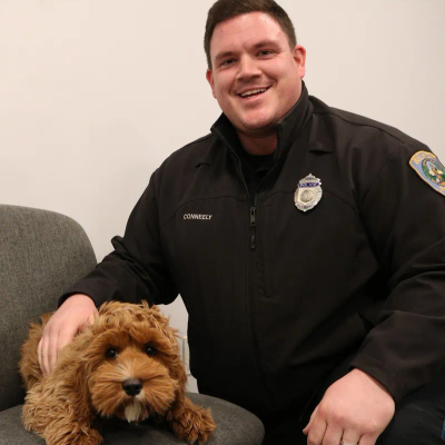 Belmont Police officer Brian Conneely and Comfort Dog Bing