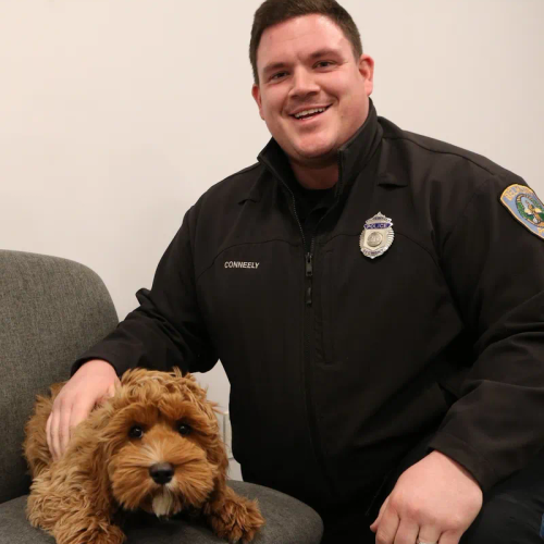 Belmont Police Officer Brian Conneely and Confort Dog Bingo