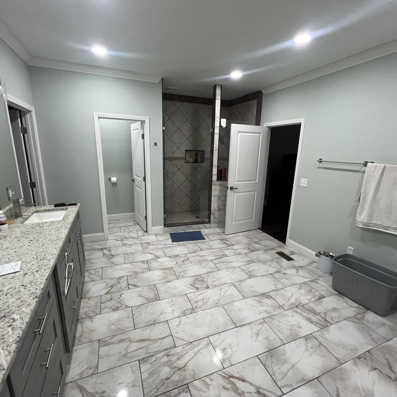 Tiled Bathroom with walk in closet