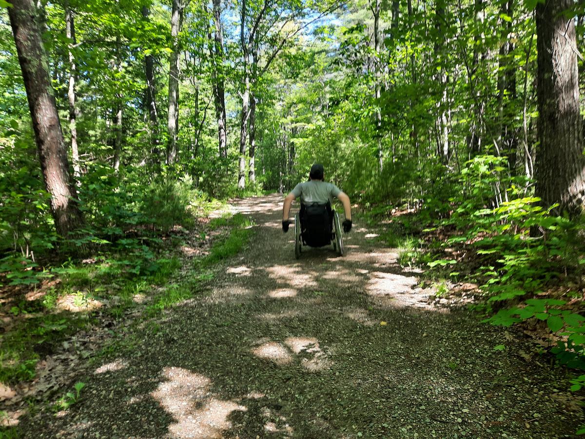 Enock enjoying the wooded trail.