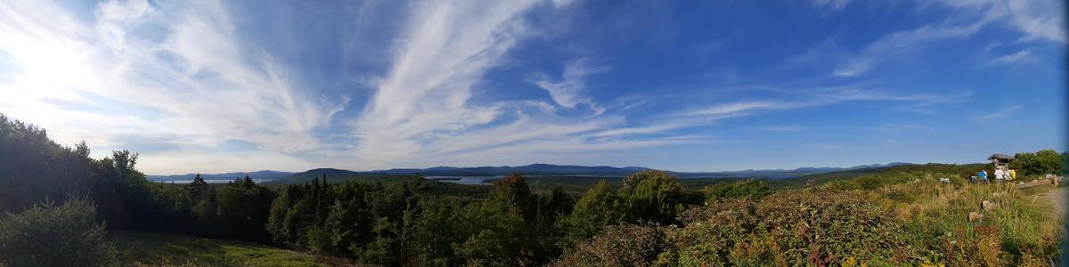 A view over mountains and lakes with dramatic clouds