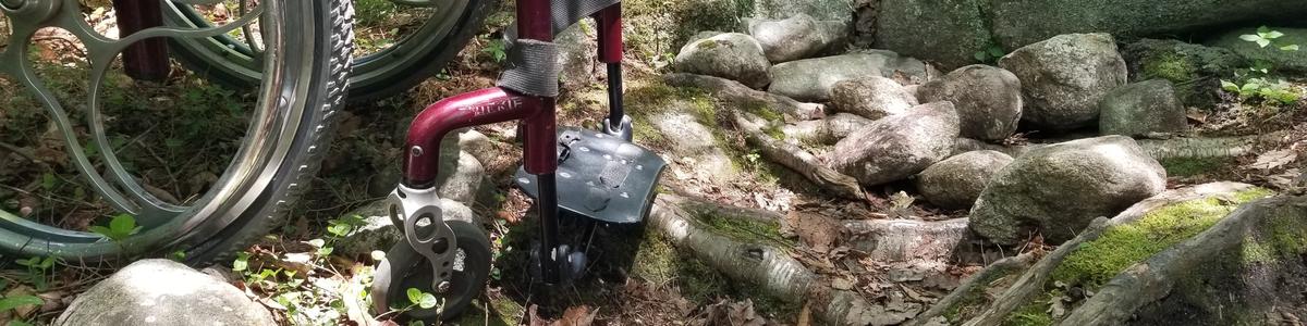 A wheelchair in a jumble of rocks