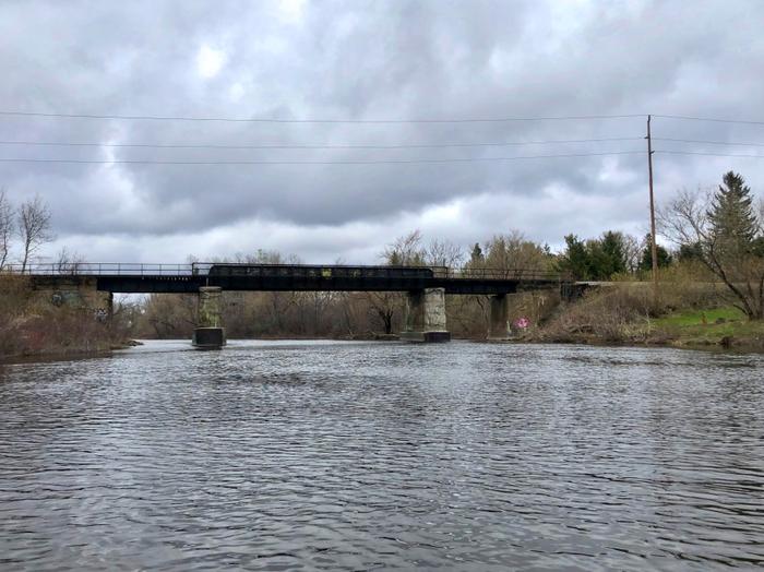 Railroad bridge heading upstream, leave town just beyond (Credit: Zip Kellogg)