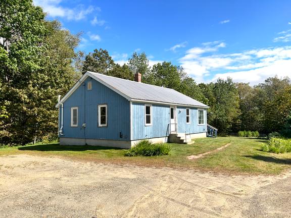 This 2 bedroom home sits on 2 acres with Temple Stream frontage!