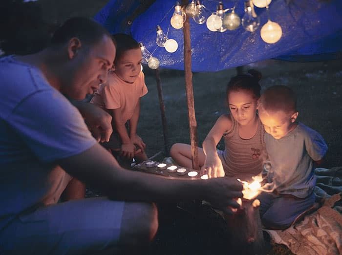 family enjoying their outdoor living space without mosquitoes