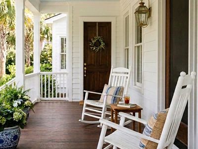 white rocking chairs on a porch