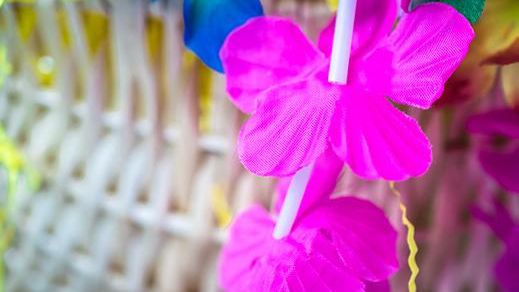 leis in a basket at hawaiian night
