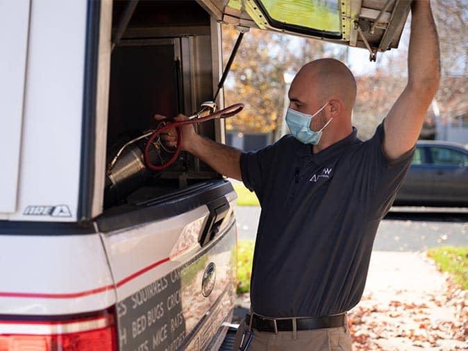 technician in front of home