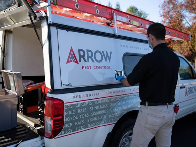 tech getting ready for professional bed bug treatment in new jersey home