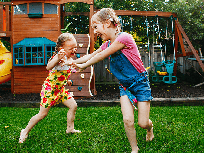 girls playing in backyard