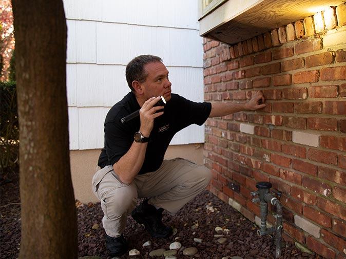 tech inspecting new jersey home for pest entry points