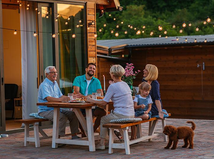 family enjoying backyard without being bitten by mosquitoes