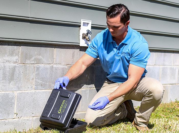 hampton roads va rodent control specialist checking bait station