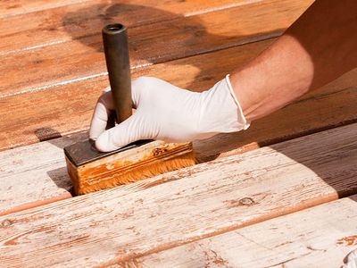 virginia homeowner staining deck in the fall