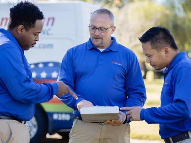 pest experts at a home