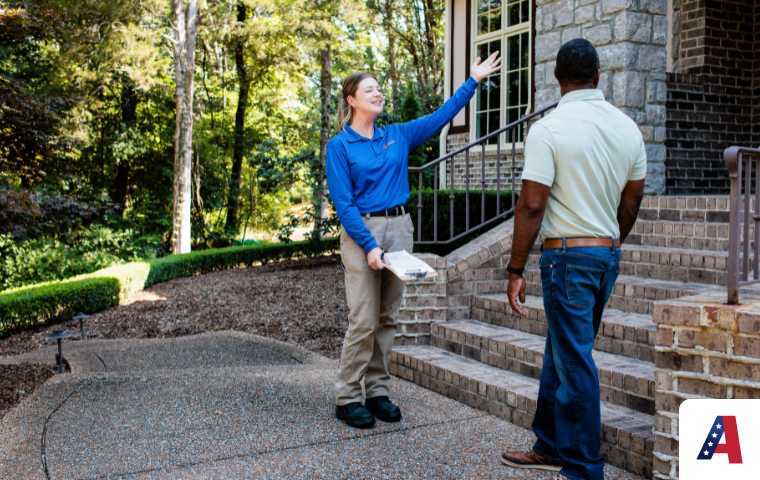 Pest control expert explaining services to customer