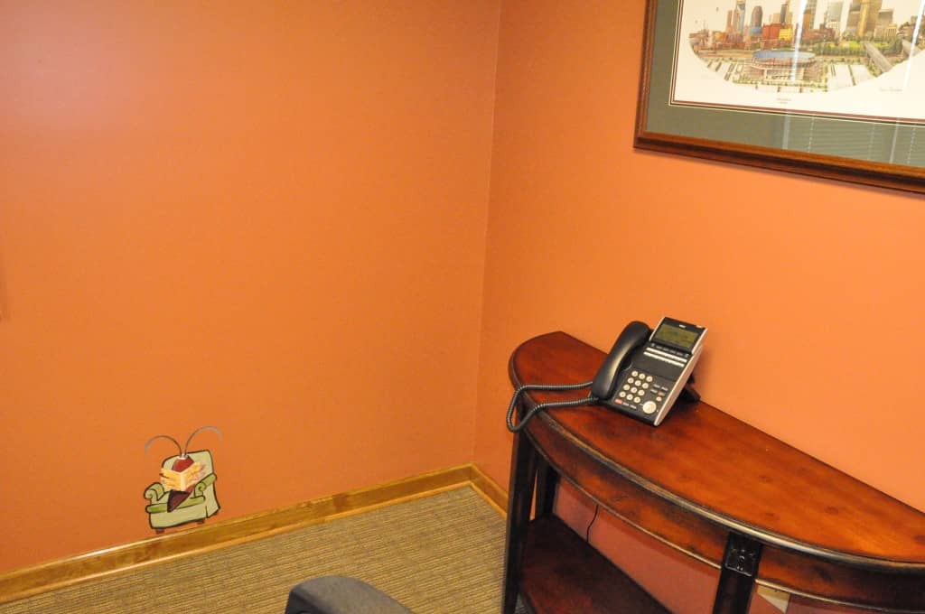 cockroach reading a book at All-American Pest Control's Office bug painting at All-American Pest Control in Nashville, TN