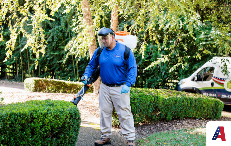 technician spraying for mosquitoes