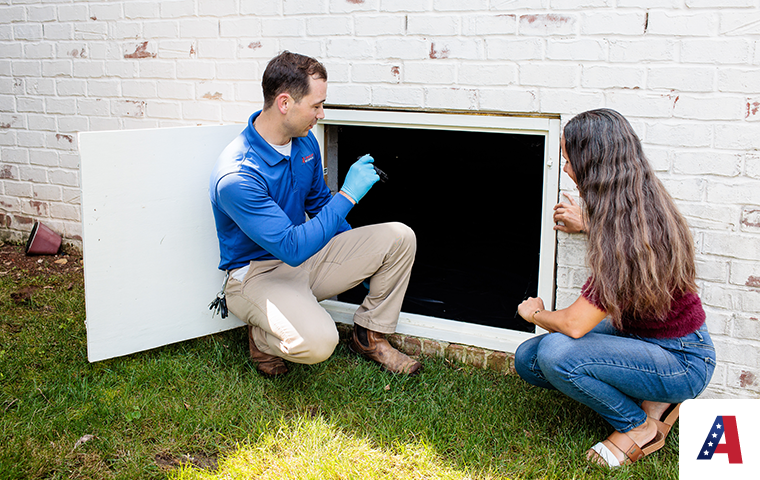 pest expert inspecting crawlspace