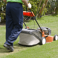 tech cutting grass