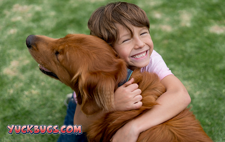 boy hugging dog