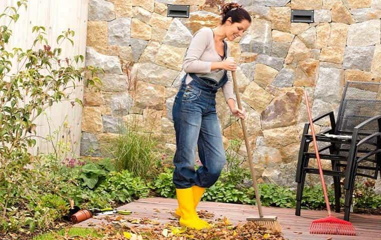 women racking yard