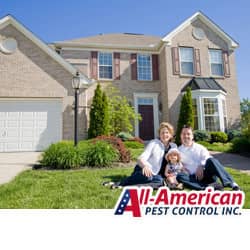 a family sitting on the yard in front of their tn home