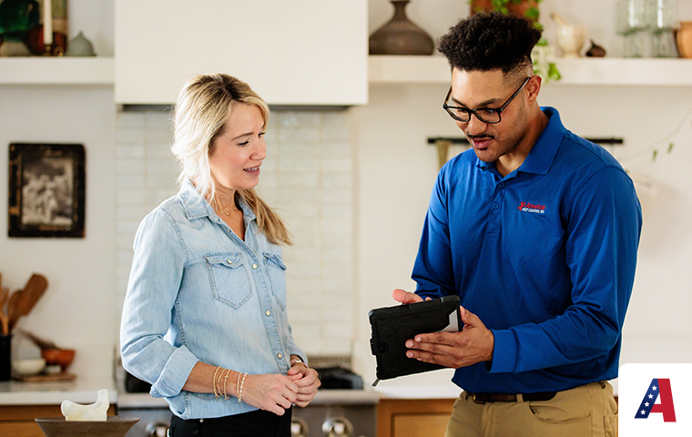 pest technician educating homeowner